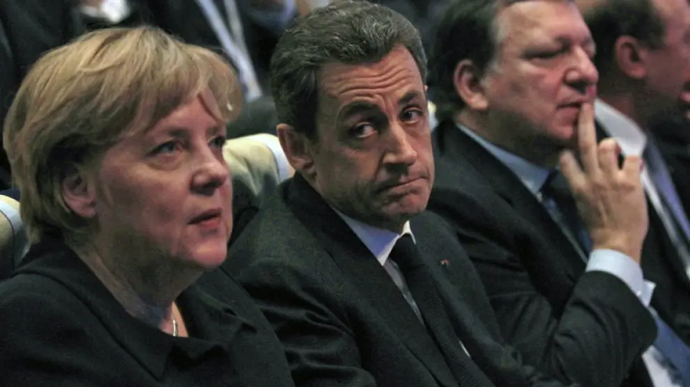 Angela Merkel y Nicolás Sarkozy, durante el Congreso del PPE