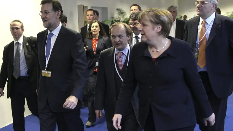 Rajoy y Merkel, en Francia