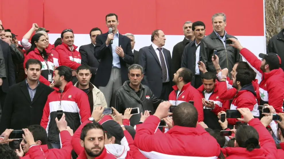 El presidente sirio, Bachar al Asad, en el centro
