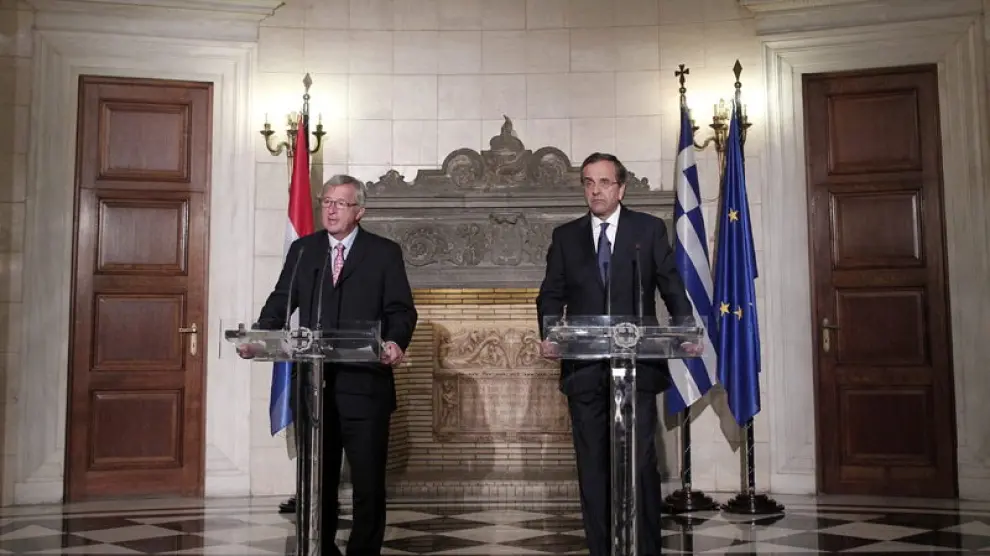 El primer ministro griego y el presidente del Eurogrupo tras la reunion