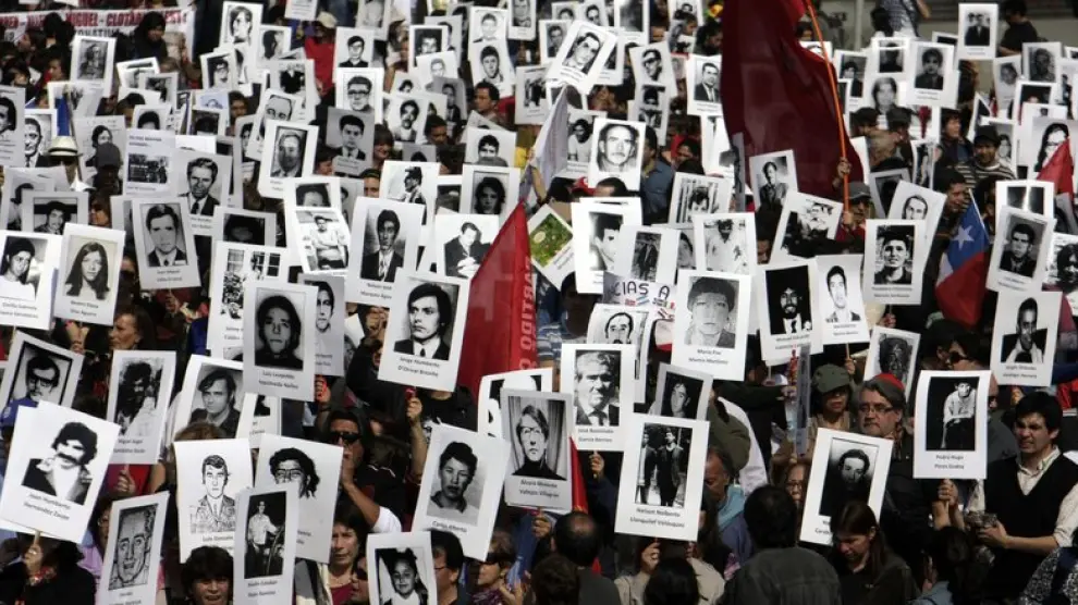 Los manifestantes portaban retratos con los rostros y los nombres de personas asesinadas