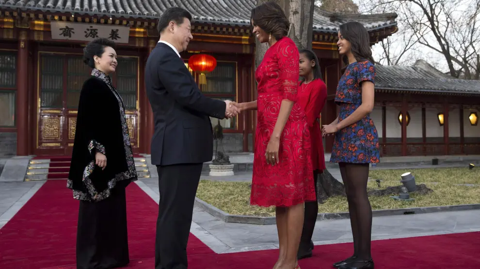 Michelle Obama saluda al presidente chino durante su visita