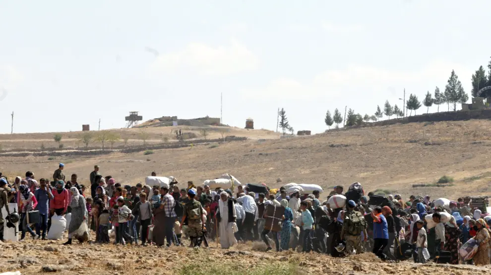 Refugiados sirios, en la frontera con Turquía, huyendo del Estado Islámico