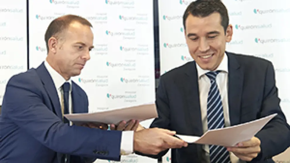 Christian Lapetra y Germán Barraqueta firman el acuerdo.
