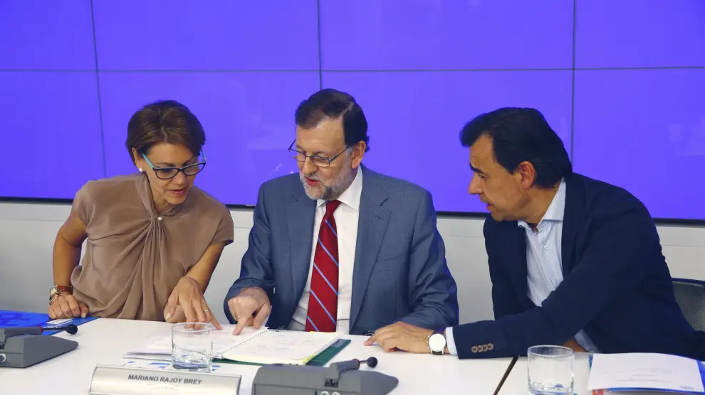 Rajoy, junto a Dolores de Cospedal y Martínez Maíllo, durante la Junta Directiva Nacional del PP.