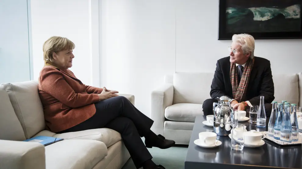 La canciller alemana Angela Merkel y el actor estadounidense Richard Gere.
