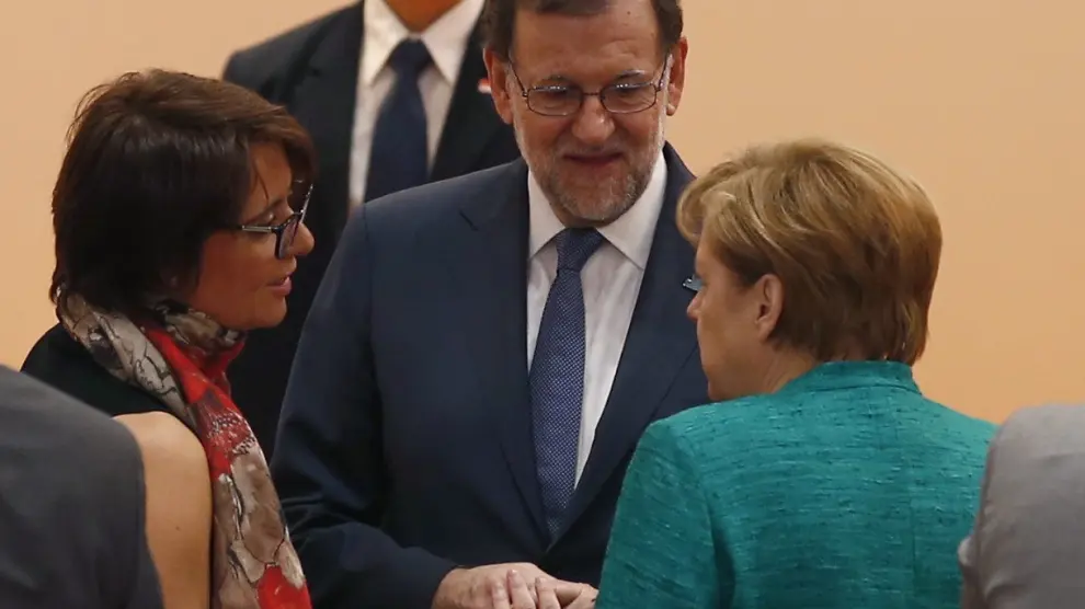 Rajoy junto a la canciller alemana, Angela Merkel.
