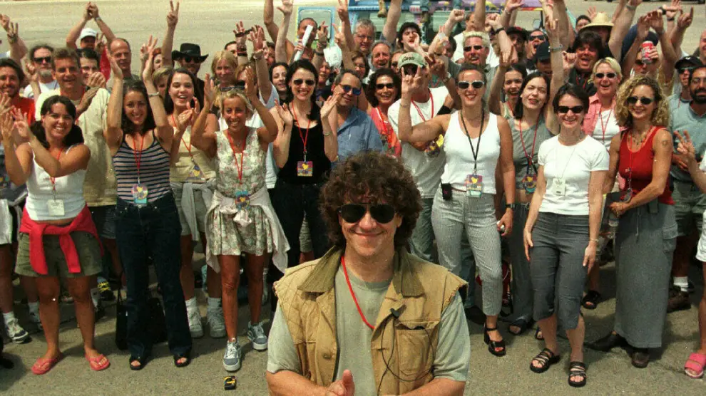 El cofundador del festival de Woodstock, Michael Lang, con su equipo en 1999.