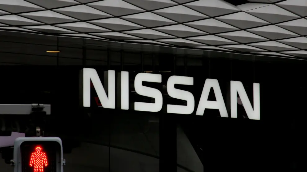 FILE PHOTO : The logo of Nissan Motor Co. is seen at its show room behind a traffic sign in Tokyo, Japan, February 12, 2019. REUTERS/Kim Kyung-hoon/File Photo [[[REUTERS VOCENTO]]] NISSAN-GHOSN/GOVERNANCE