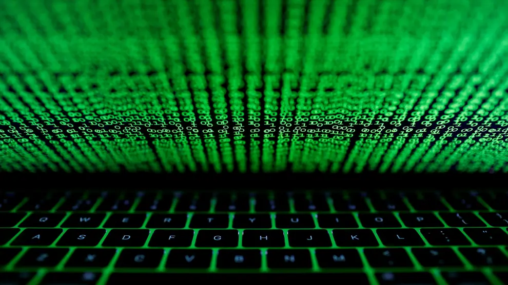 FILE PHOTO: A computer keyboard lit by a displayed cyber code is seen in this illustration picture taken on March 1,  2017. REUTERS/Kacper Pempel/Illustration/File Photo [[[REUTERS VOCENTO]]] BANKS-DATA/