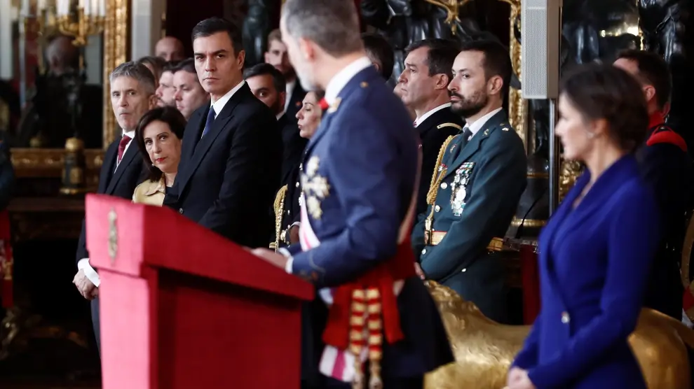 Pedro Sánchez, junto a Margarita Robles y Fernando Grande-Marlaska durante el discurso del Rey en la Pascua Militar