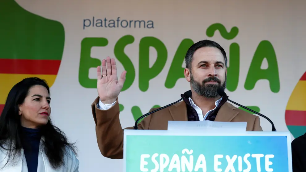 Santiago Abascal, leader of the far-right party VOX, speaks next to Madrid's regional Vox leader Rocio Monasterio, during a rally in protest against the new coalition government led by Spain's Prime Minister Pedro Sanchez, at Cibeles Square in Madrid, Spain, January 12, 2020. REUTERS/Jon Nazca [[[REUTERS VOCENTO]]] SPAIN-POLITICS/PROTEST