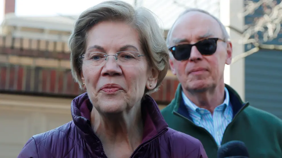 Democratic U.S. presidential candidate Warren talks to reporters in Cambridge