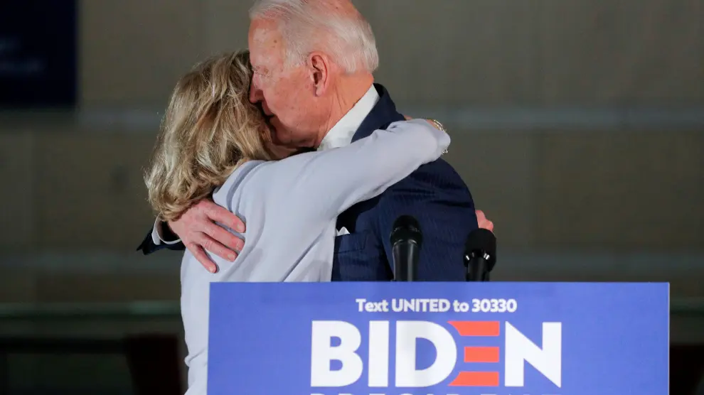 Democratic U.S. presidential candidate and former Vice President Joe Biden hugs his wife Jill after a primary night speech in Philadelphia