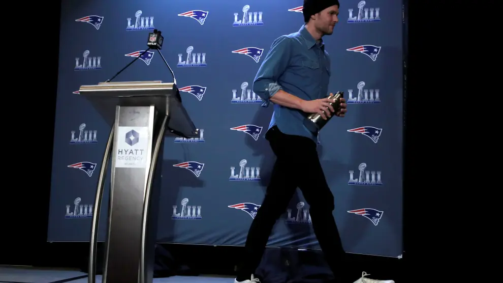 FILE PHOTO: New England Patriots quarterback Tom Brady walks from the podium after speaking at a press conference ahead of Super Bowl LIII in Atlanta