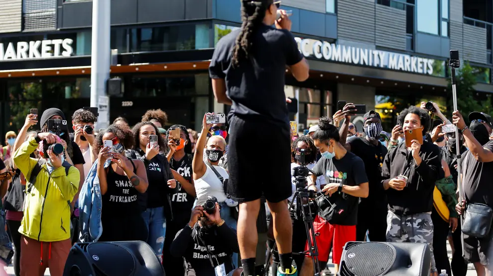 People gather against gentrification during the Fourth of July holiday in Seattle
