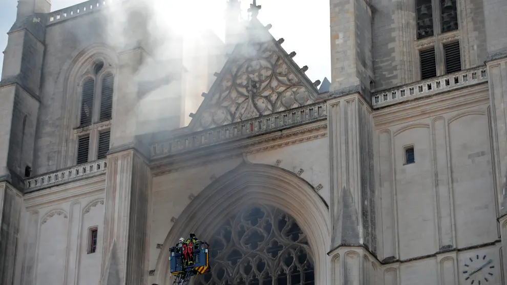 French firefighters battle a blaze at the Cathedral of Saint Pierre and Saint Paul in Nantes, France, July 18, 2020. REUTERS/Stephane Mahe [[[REUTERS VOCENTO]]] FRANCE-FIRE/NANTES-CATHEDRAL