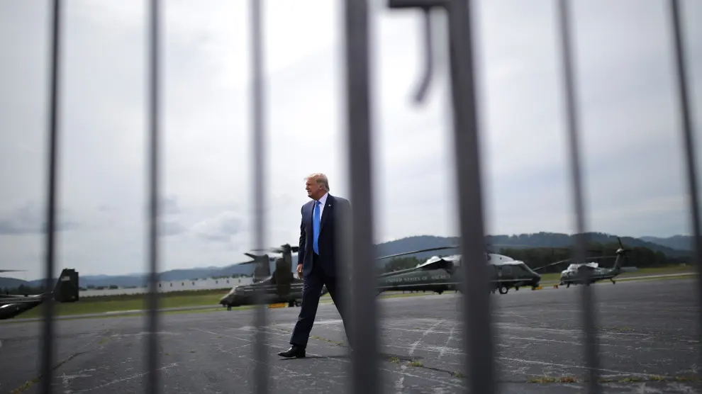 U.S. President Donald Trump greets supporters on a tarmac after he arrived by helicopter at Asheville Regional Airport in Asheville, North Carolina