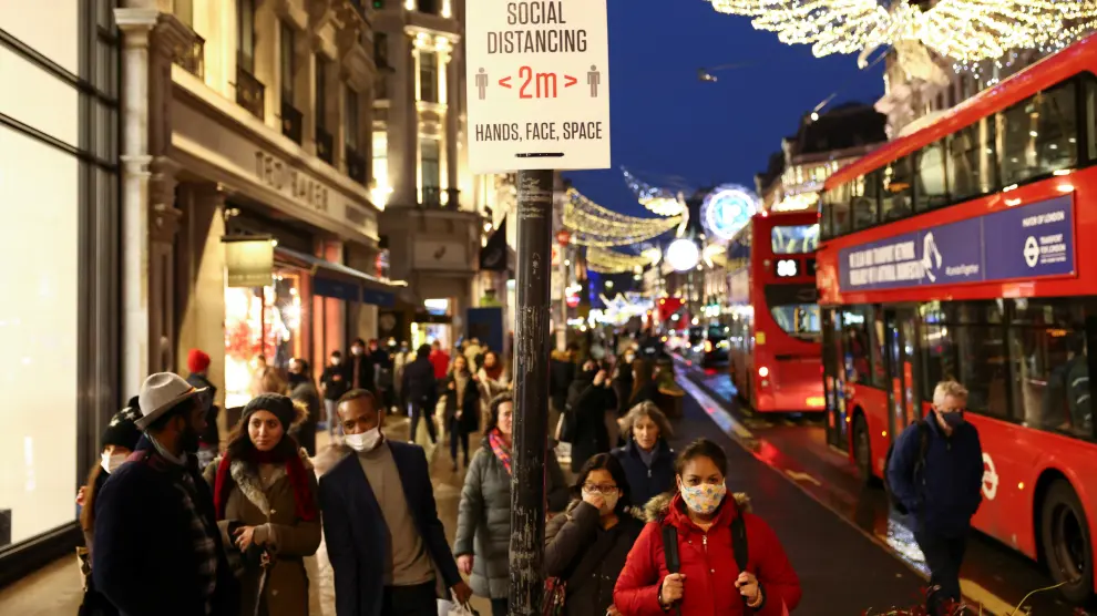 People walk along Regent Street, amid the coronavirus disease (COVID-19) outbreak, in London