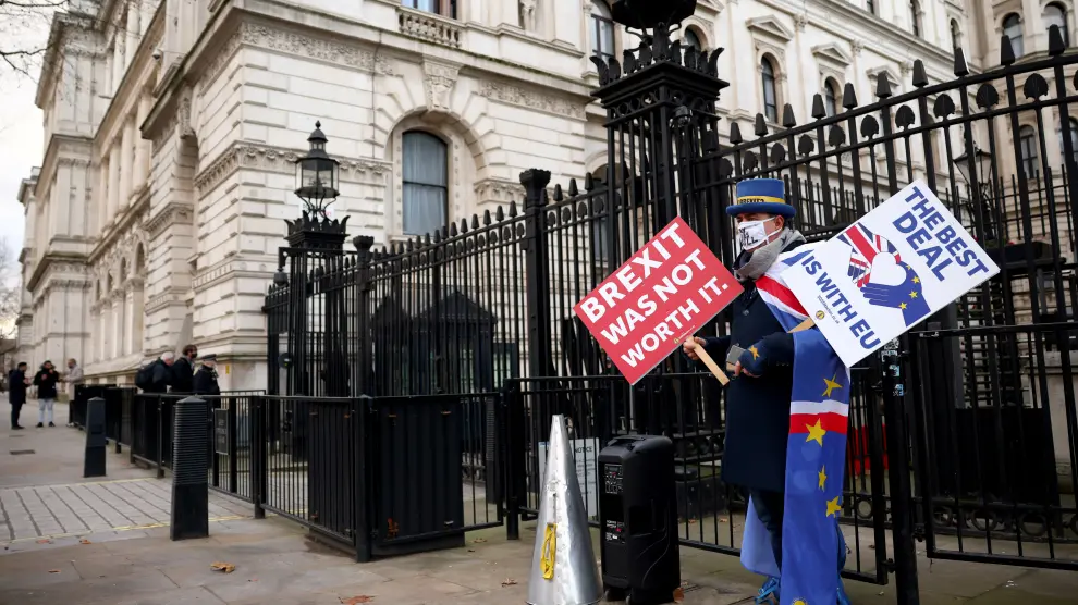 Anti-Brexit protester Steve Bray holds signs outside entrance to Downing Street in London