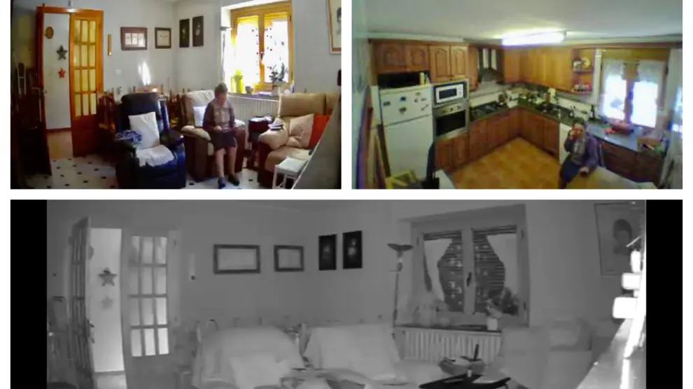Pilar Noguera, en su casa del Pirineo oscense, vista a través de la cámara instalada en el salón y la cocina.