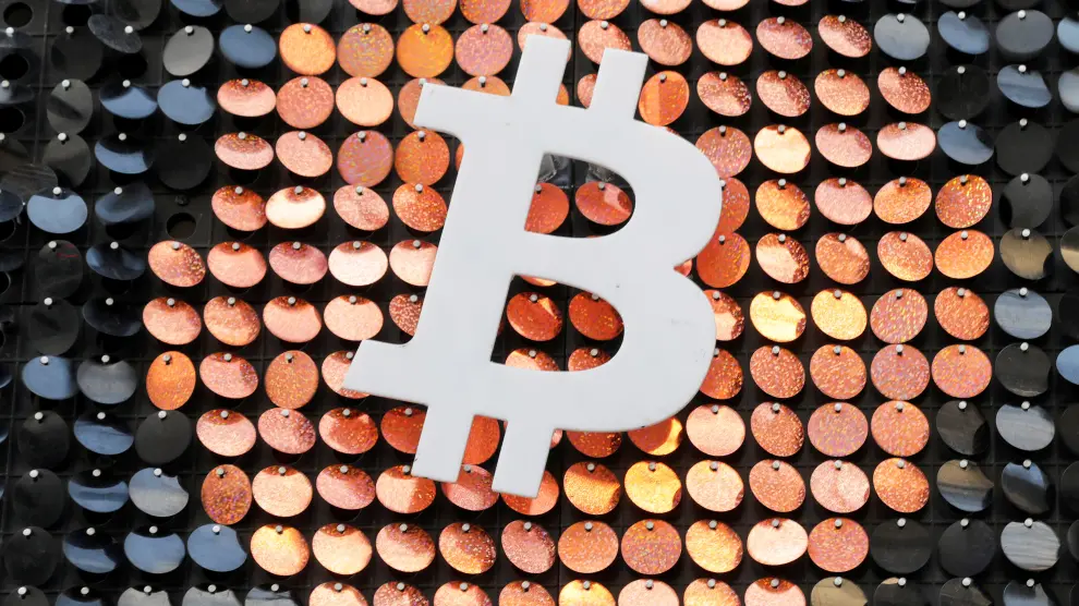 FILE PHOTO: The logo of the Bitcoin digital currency is seen in a shop in Marseille