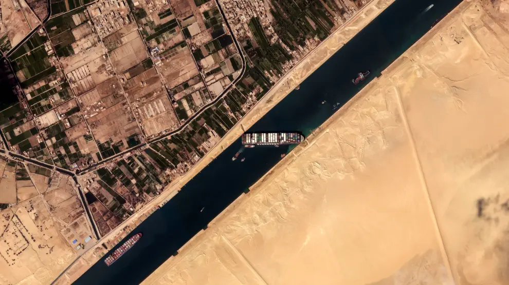 HANDOUT - 26 March 2021, Egypt, Suez: A satellite image provided by the European Space Imaging on 26 March 2021 shows the Ever HANDOUT - 26 March 2021, Egypt, Suez: A satellite image provided by the European Space Imaging on 26 March 2021 shows the "Ever Given", a container ship operated by the Evergreen Marine Corporation, is currently stuck in the Suez Canal. The state-run Suez