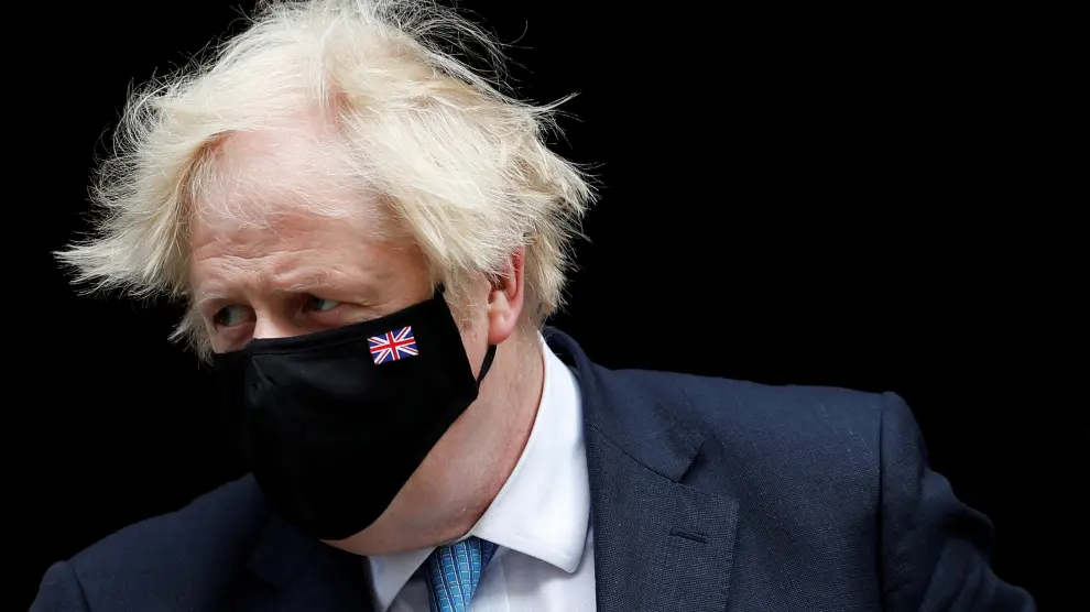 FILE PHOTO: Britain's PM Johnson walks on Downing Street in London
