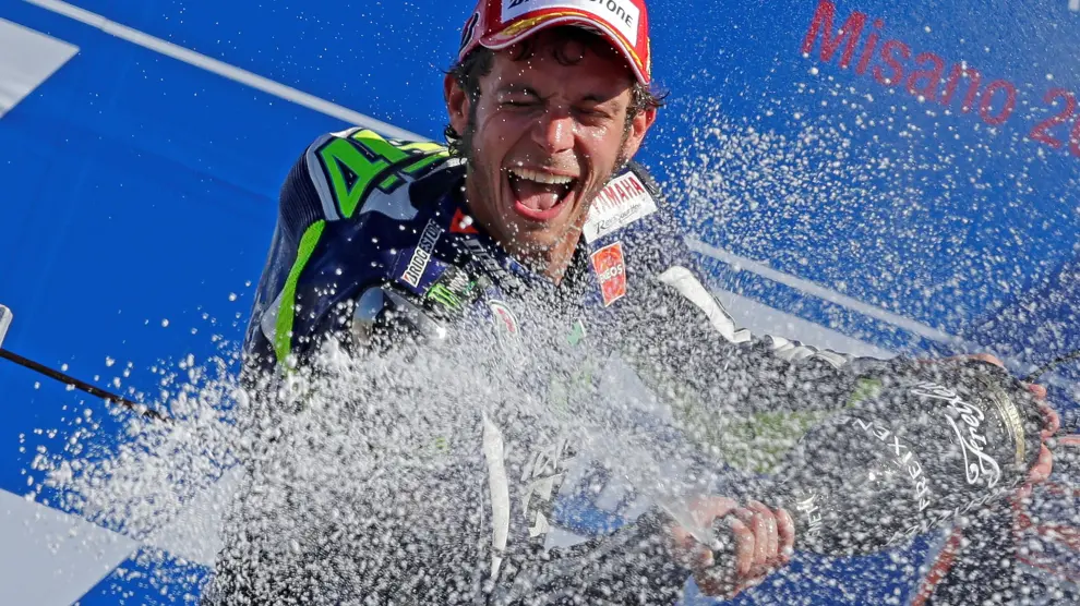 FILE PHOTO: Yamaha MotoGP rider Rossi of Italy sprays champagne on the podium after winning the San Marino Grand Prix in Misano Adriatico circuit in central Italy