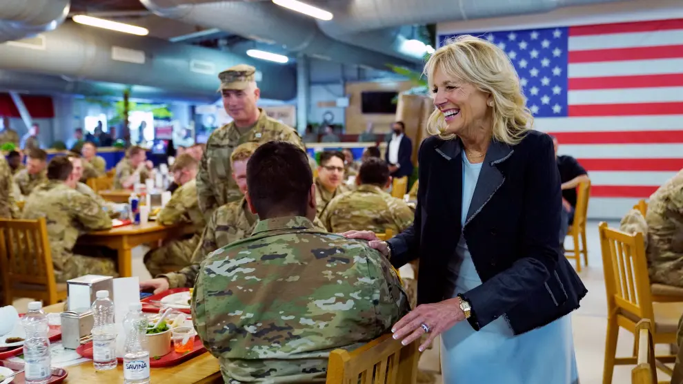 U.S. First lady Jill Biden cuts a cake with George Ciolache, the cake maker, as she meets with U.S. troops during a visit to the Mihail Kogalniceanu Air Base in Romania, Friday, May 6, 2022. Susan Walsh/Pool via REUTERS UKRAINE-CRISIS/JILL BIDEN