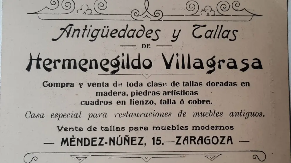 Un cartel de Hermenegildo Villagrasa y su tienda de anticuario en Zaragoza.