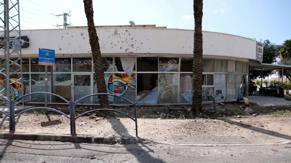 A damaged building of a bank is seen following incoming rockets from Lebanon to Israel in Shlomi
