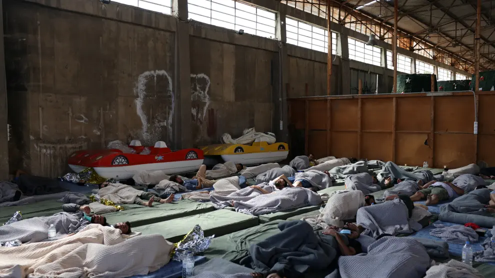 Migrants rest in a shelter, following a rescue operation, after their boat capsized at open sea, in Kalamata, Greece, June 14, 2023. REUTERS/Stelios Misinas EUROPE-MIGRANTS/GREECE-SHIPWRECK