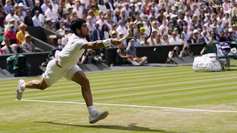 Spain's Carlos Alcaraz in action against Serbia's Novak Djokovic during the men's singles final on day fourteen of the Wimbledon tennis championships in London, Sunday, July 16, 2023. (AP Photo/Alberto Pezzali)