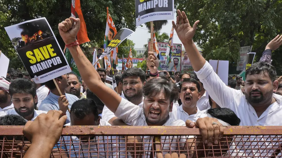 Members of the youth wing of India's Congress party shout slogans during a protest near Parliament House in New Delhi, India, Thursday, July 20, 2023. The protest was against deadly ethnic clashes in the country's northeast after a video showed two women being assaulted by a mob. The video triggered outrage across India and was widely shared on social media despite the internet being largely blocked in remote Manipur state. (AP Photo/Manish Swarup)