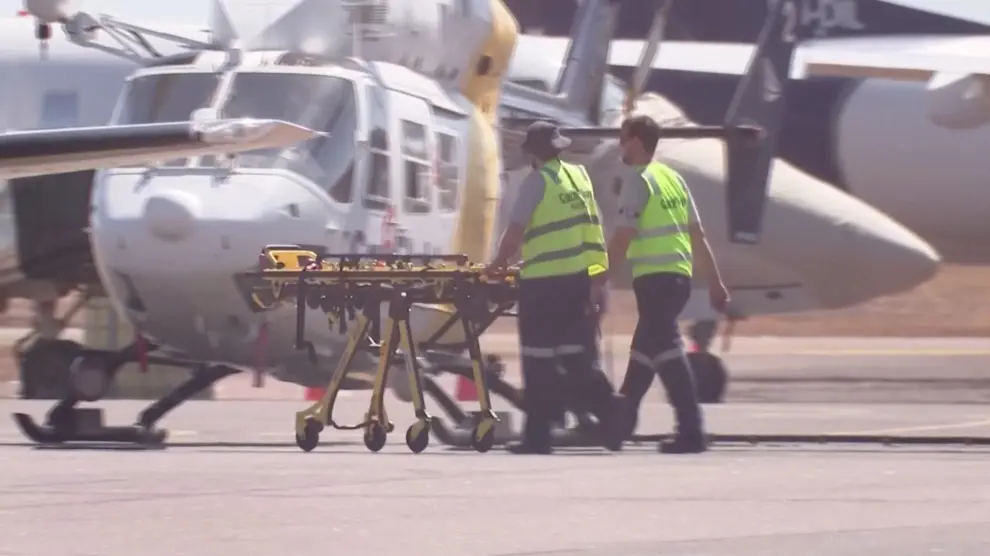 Paramedics push a stretcher following U.S. military aircraft crash in Darwin, Australia, August 27, 2023 in this screen grab obtained from a handout video. AUSTRALIAN BROADCASTING CORPORATION/via Reuters TV/Handout via REUTERS THIS IMAGE HAS BEEN SUPPLIED BY A THIRD PARTY. AUSTRALIA OUT. NO COMMERCIAL OR EDITORIAL SALES IN AUSTRALIA. NO USE AUSTRALIA/ANY INTERNET SITE OF ANY AUSTRALIA BASED MEDIA ORGANISATIONS OR MOBILE PLATFORMS.