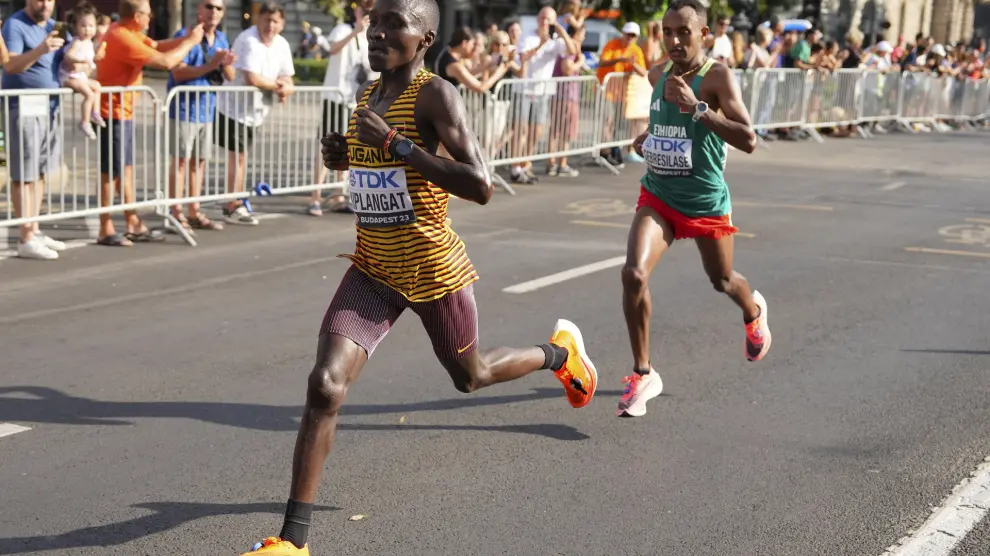Uganda's Victor Kiplangat leads Ethiopia's Leul Gebresilase in the Men's marathon at the World Athletics Championships in Budapest, Hungary, Sunday, Aug. 27, 2023. (Aleksandra Szmigiel, Pool via AP)