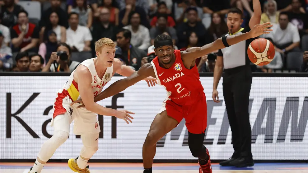 Basketball - FIBA World Cup 2023 - Second Round - Group L - Spain v Canada - Indonesia Arena, Jakarta, Indonesia - September 3, 2023 Spain's Sergio Llull in action with Canada's Luguentz Dort REUTERS/Willy Kurniawan BASKETBALL-WORLDCUP-ESP-CAN/
