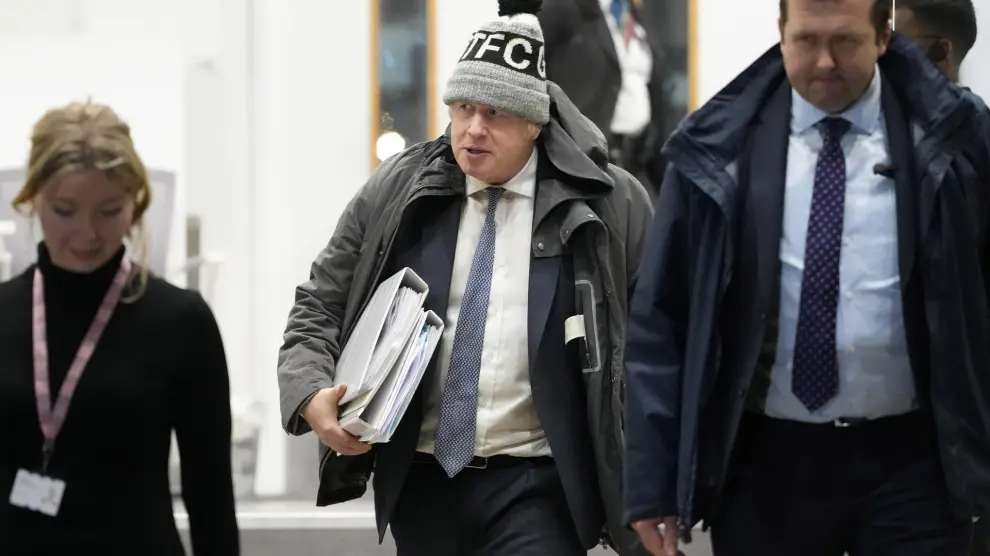 Britain's former Prime Minister Boris Johnson leaves after the COVID Inquiry at Dorland House in London, Thursday, Dec. 7, 2023. Johnson rejected suggestions that he wanted to let COVID-19 "rip" through the population as he defended his handling of the pandemic during a second day of testimony at a public inquiry into the crisis. (AP Photo/Kirsty Wigglesworth) Britain's former Prime Minister Boris Johnson leaves after the COVID Inquiry at Dorland House in London, Thursday, Dec. 7, 2023. Johnson rejected suggestions that he wanted to let COVID-19 "rip" through the population as he defended his handling of the pandemic during a second day of testimony at a public inquiry into the crisis. (AP Photo/Kirsty Wigglesworth)