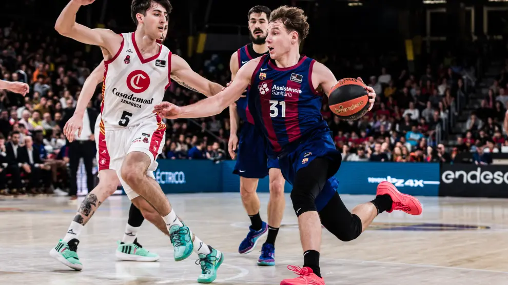 Rokas Jokubaitis of Fc Barcelona in action against Lucas Langarita of Casademont Zaragoza during the ACB Liga Endesa, match played between FC Barcelona and Casademont Zaragozaza at Palau Blaugrana on March 03, 2024 in Barcelona, Spain...AFP7 ..03/03/2024 ONLY FOR USE IN SPAIN [[[EP]]]