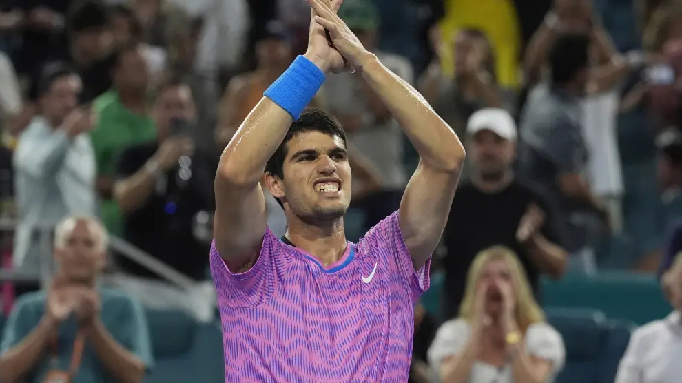 Carlos Alcaraz of Spain celebrates after defeating Lorenzo Musetti of Italy during the Miami Open tennis tournament, Tuesday, March 26, 2024, in Miami Gardens, Fla. (AP Photo/Marta Lavandier)
