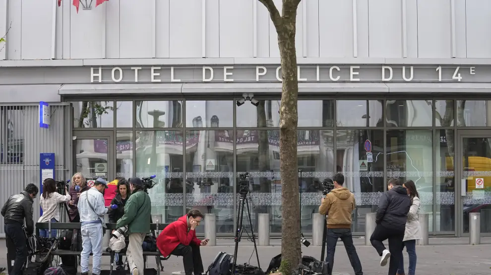 Reporters wait outside the police station where French actor Gerard Depardieu is being questioned, Monday, April 29, 2024 in Paris. French media are reporting that police have summoned actor Gerard Depardieu for questioning about allegations made by two women that he sexually assaulted them on movie sets. (AP Photo/Michel Euler)