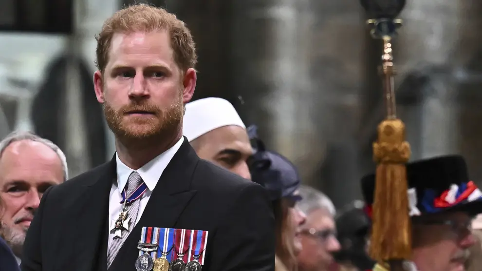 FILE -Britain's Prince Harry, Duke of Sussex looks on as Britain's King Charles III leaves Westminster Abbey after coronation in central London Saturday, May 6, 2023. (Ben Stansall/Pool photo via AP, FIle)