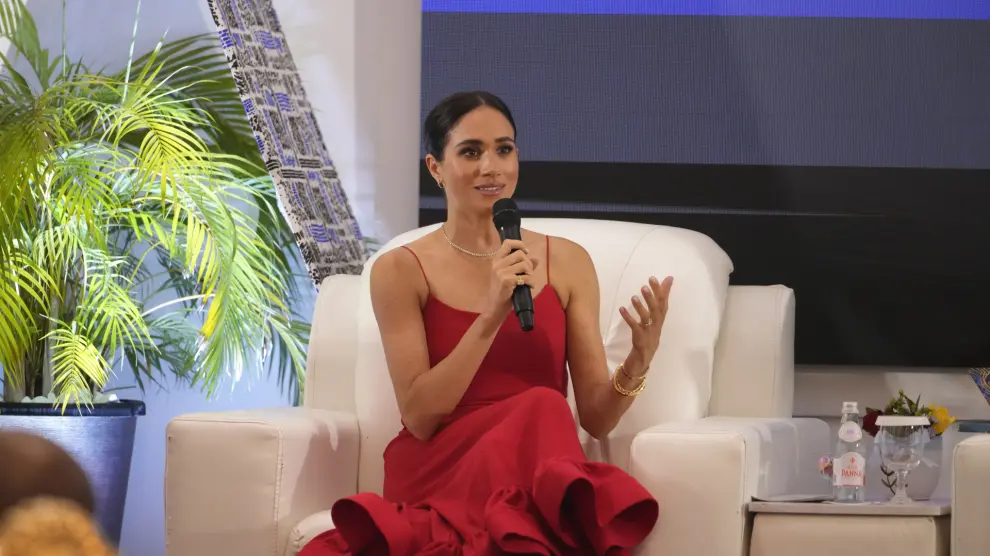 Meghan, the Duchess of Sussex, speaks at an event in Abuja, Nigeria, Saturday, May 11, 2024. Meghan, the Duchess of Sussex, says it’s been “humbling” to find out through a genealogy test that she is partly Nigerian. She was speaking at a meeting with Nigerian female industry leaders at an event on Saturday, her second day in the West African nation where she is visiting with Harry, her husband. (AP Photo/Sunday Alamba)