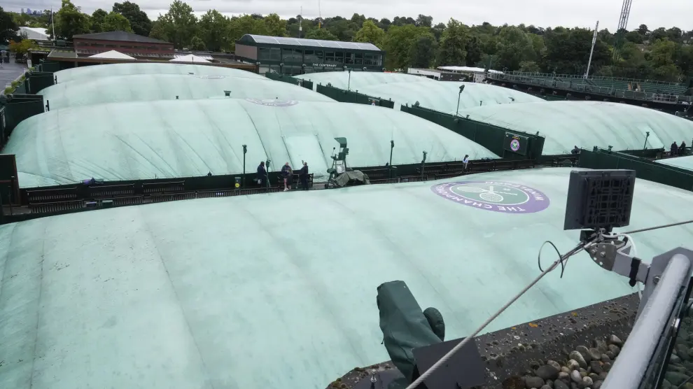 The outside courts under covers ahead of play for the third round matches at the Wimbledon tennis championships in London, Friday, July 5, 2024. (AP Photo/Mark Baker)