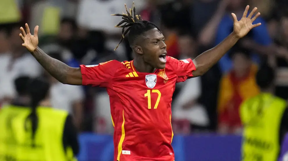 Spain's Nico Williams celebrates after scoring the opening goal during the final match between Spain and England at the Euro 2024 soccer tournament in Berlin, Germany, Sunday, July 14, 2024. (AP Photo/Manu Fernandez)