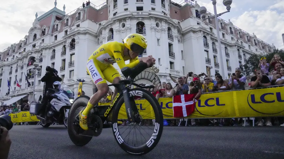 Slovenia's Tadej Pogacar, wearing the overall leader's yellow jersey, rides during the twenty-first stage of the Tour de France cycling race, an individual time trial over 33.7 kilometers (20.9 miles) with start in Monaco and finish in Nice, France, Sunday, July 21, 2024. (AP Photo/Jerome Delay)