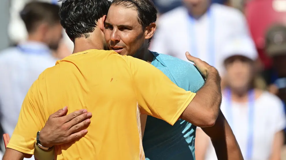 Portugal's Nuno Borges, left, hugs Spain's Rafael Nadal, right, after winning the singles final of the Nordea Open tennis tournament in Bastad, Sweden, Sunday, July 21, 2024. (Bjoern Larsson Rosvall/TT News Agency via AP)