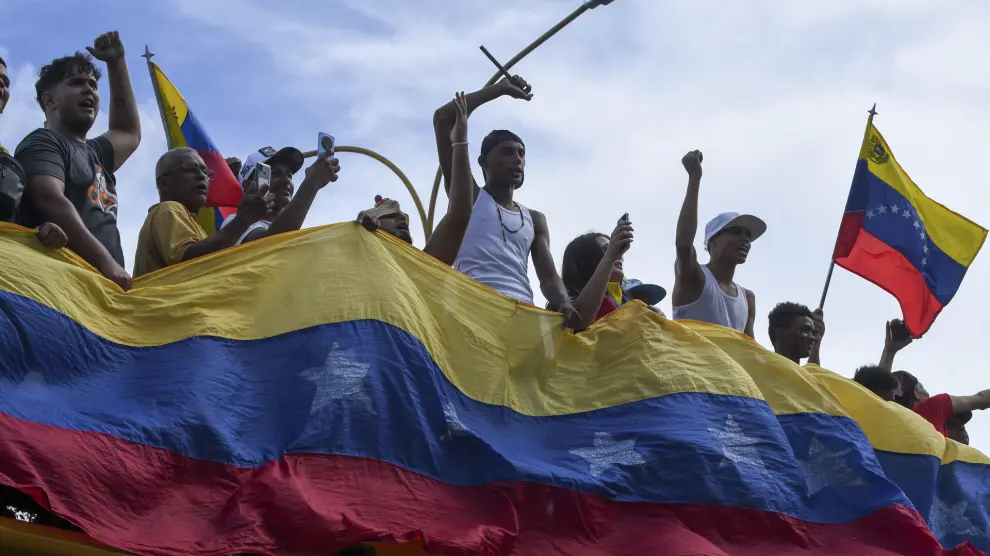 Protesters demonstrate against the official election results declaring President Nicolas Maduro's reelection, the day after the vote in Valencia, Venezuela, Monday, July 29, 2024. (AP Photo/Jacinto Oliveros)