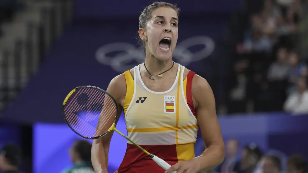 Spain's Carolina Marin reacts as she plays against Switzerland's Jenjira Stadelman during their women's singles badminton group stage match at the 2024 Summer Olympics, Sunday, July 28, 2024, in Paris, France. (AP Photo/Kin Cheung)